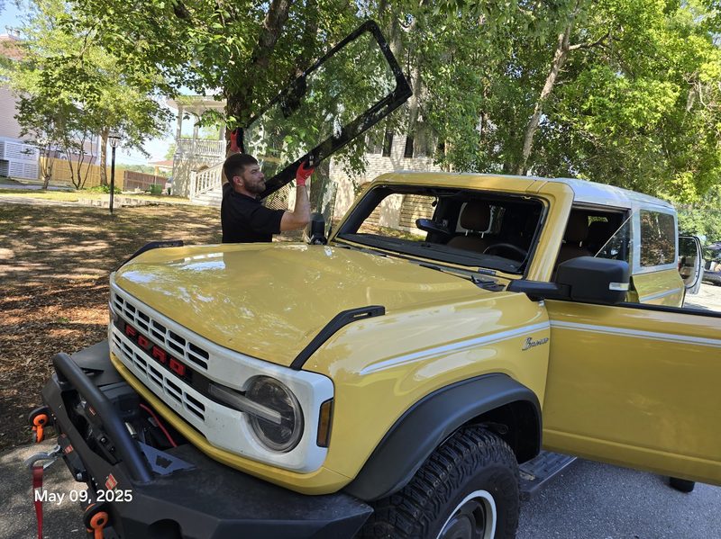 Mission Auto Glass technician performing mobile windshield replacement on Folly Beach