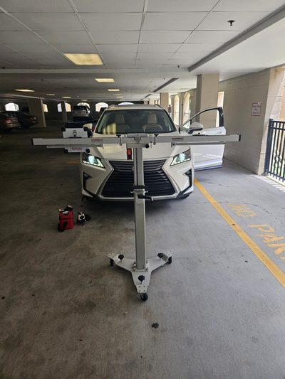 ADAS recalibration being performed on a vehicle after windshield replacement