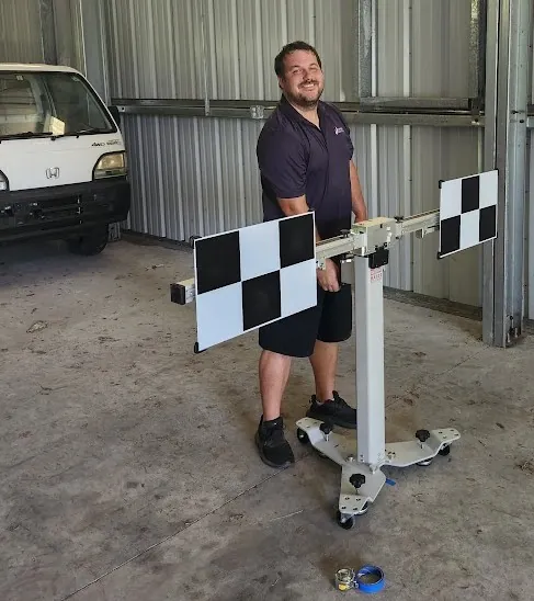 Mission Auto Glass technician performing static ADAS calibration with Autel target equipment in Charleston SC shop